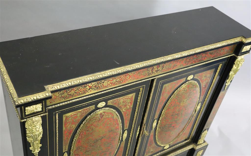 A 19th century French red buhl work and ebony side cabinet, W.4ft 4in. D.1ft 4in. H.3ft 11in.